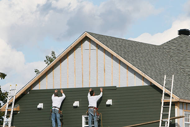 Professional Siding Contractor technician working in East Northport, NY